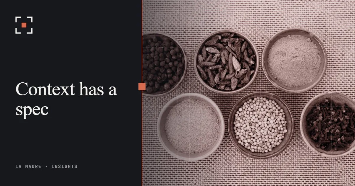 Six small bowls of spices arranged on a table, in La Madre duotone, beside the words Context has a spec
