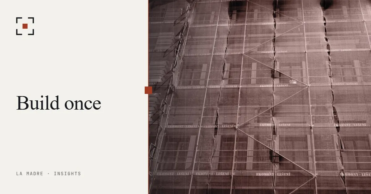 Building scaffolding covered with mesh, in La Madre duotone, beside the words Build once