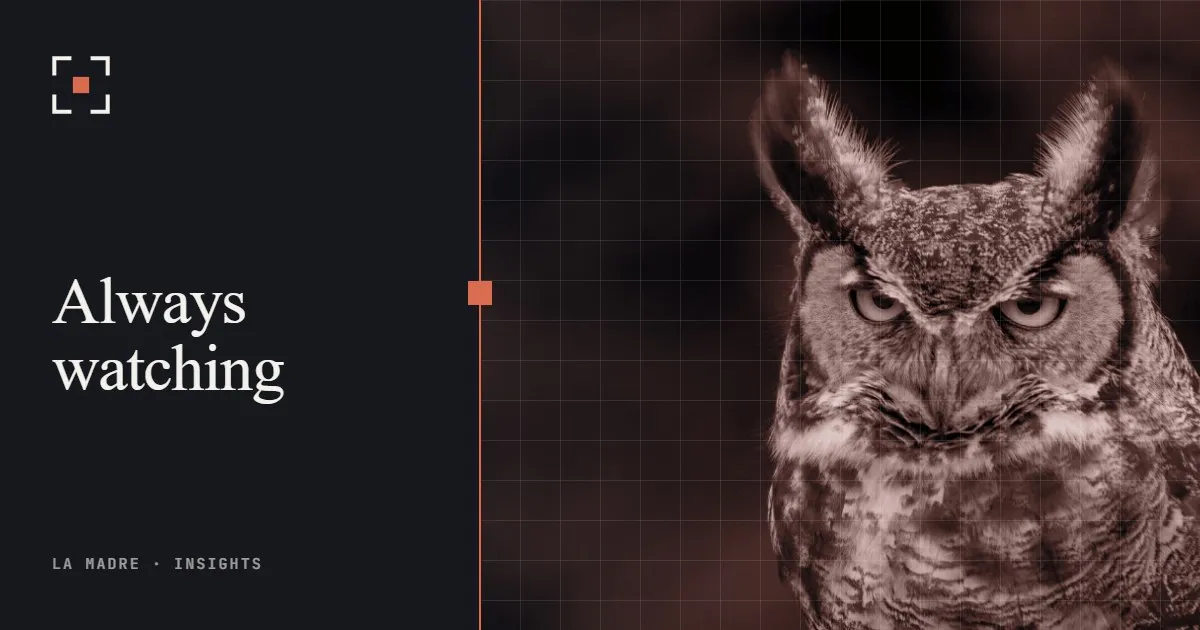 A great horned owl looking straight ahead, in La Madre duotone, beside the words Always watching