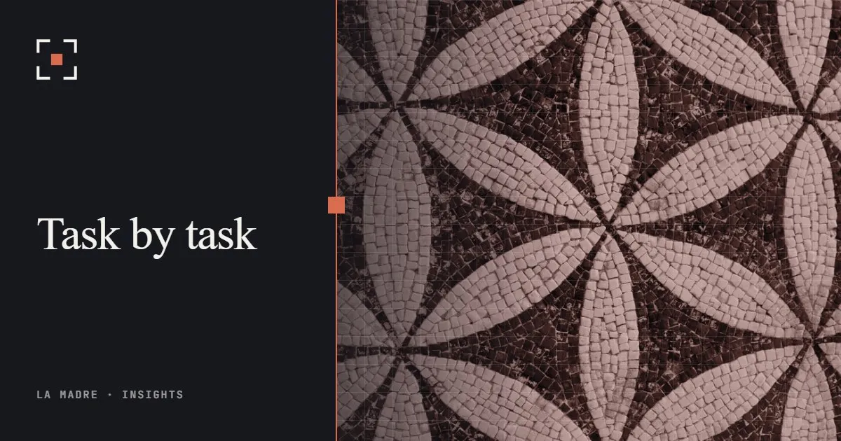 A mosaic of small stone tiles forming petals, in La Madre duotone, beside the words Task by task