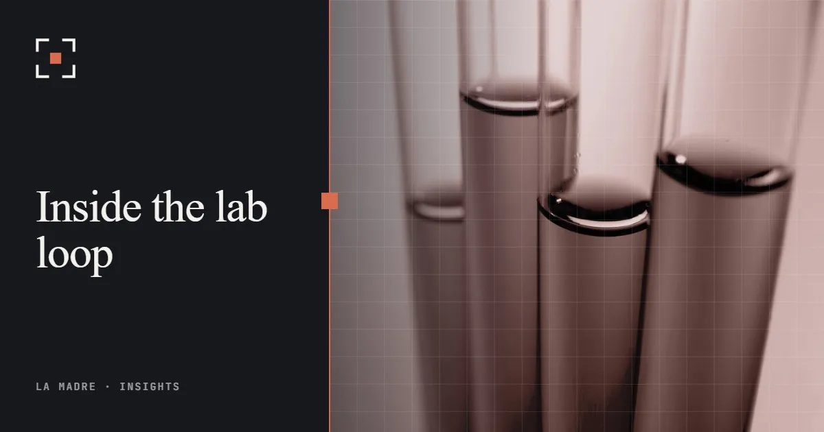 Glass test tubes filled with liquid, in La Madre duotone, beside the words Inside the lab loop