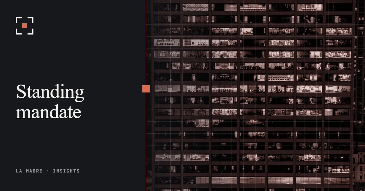 Office tower at night with lit windows, in La Madre duotone, beside the words Standing mandate