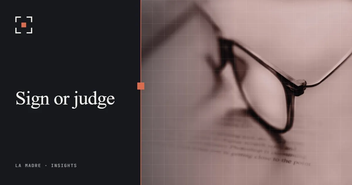 Reading glasses resting on a page, in La Madre duotone, beside the words Sign or judge