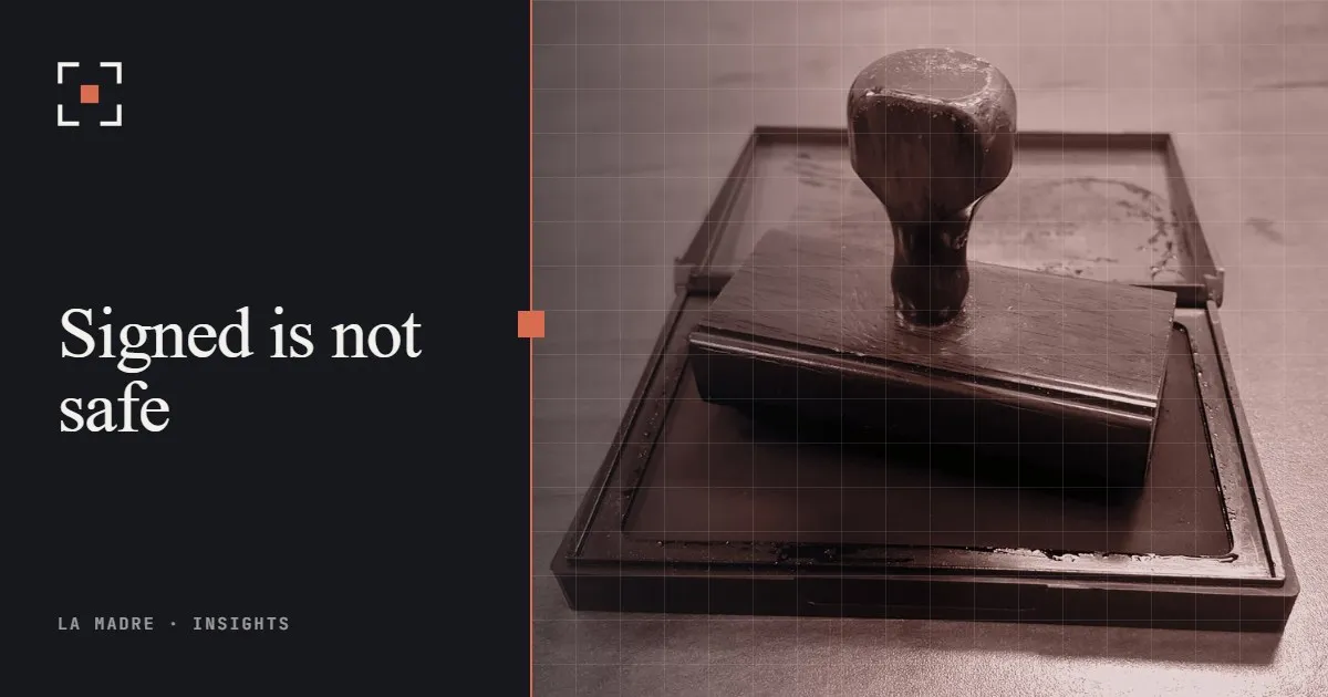 A wooden rubber stamp resting on an open ink pad, in La Madre duotone, beside the words Signed is not safe