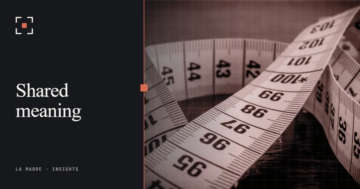 A coiled tape measure, in La Madre duotone, beside the words Shared meaning